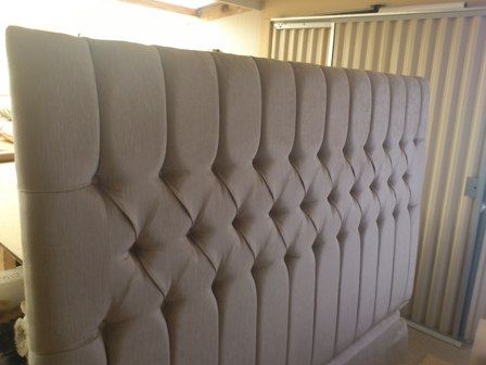 Headboard with deep buttons & channels.